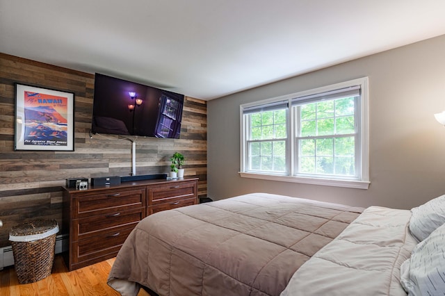 320 Spruce St, Cheshire, CT 06410 - bedroom with wood walls, an accent wall, and light wood-style floors