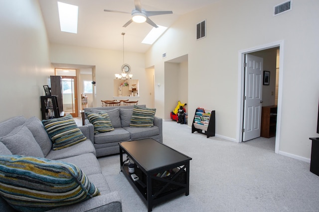 38 Simsbury Lndg Unit 38, Simsbury, CT 06070 - living room with a skylight, a chandelier, a ceiling fan, light colored carpet, and high vaulted ceiling
