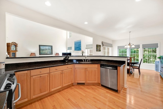 111 Thorn Hollow Rd, Cheshire, CT 06410 - kitchen featuring stainless steel appliances, light wood-style floors, a sink, recessed lighting, and dark stone counters