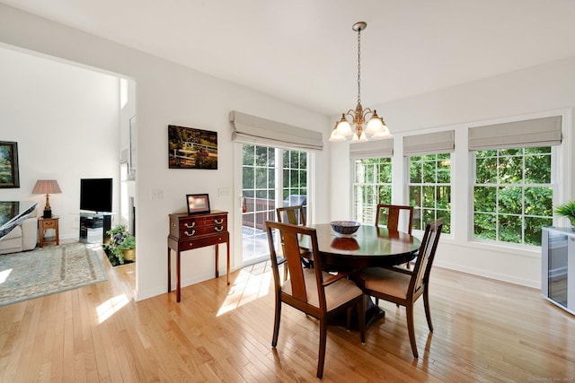 111 Thorn Hollow Rd, Cheshire, CT 06410 - dining room featuring a chandelier, light wood-type flooring, and baseboards