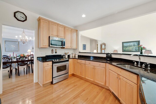 111 Thorn Hollow Rd, Cheshire, CT 06410 - kitchen featuring stainless steel appliances, light brown cabinetry, a sink, light wood-type flooring, and a chandelier