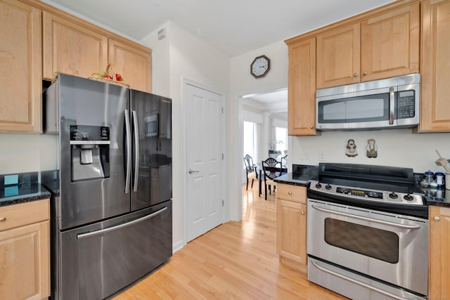 111 Thorn Hollow Rd, Cheshire, CT 06410 - kitchen with appliances with stainless steel finishes, light wood-style flooring, light brown cabinets, and dark stone counters