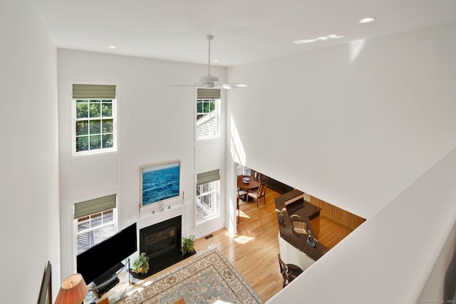 111 Thorn Hollow Rd, Cheshire, CT 06410 - living room with light wood-style flooring, a fireplace with flush hearth, recessed lighting, and a ceiling fan