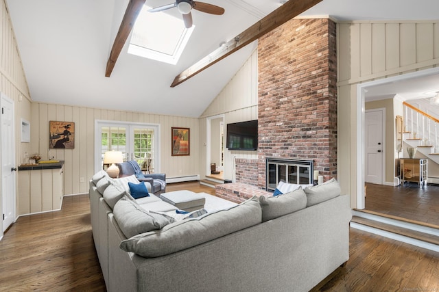 68 Mopus Bridge Rd, Ridgefield, CT 06877 - living room with a ceiling fan, a skylight, wood finished floors, high vaulted ceiling, and baseboard heating