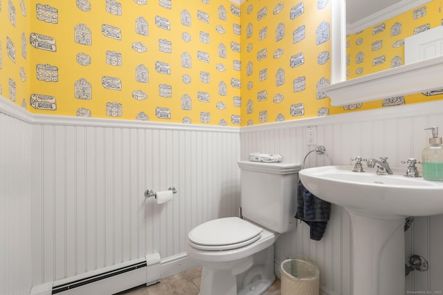 68 Mopus Bridge Rd, Ridgefield, CT 06877 - half bath featuring a baseboard heating unit, a wainscoted wall, tile patterned floors, and ornamental molding