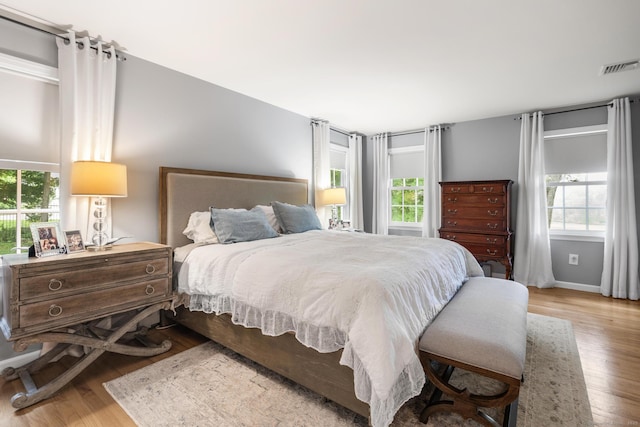 68 Mopus Bridge Rd, Ridgefield, CT 06877 - bedroom with multiple windows and wood finished floors