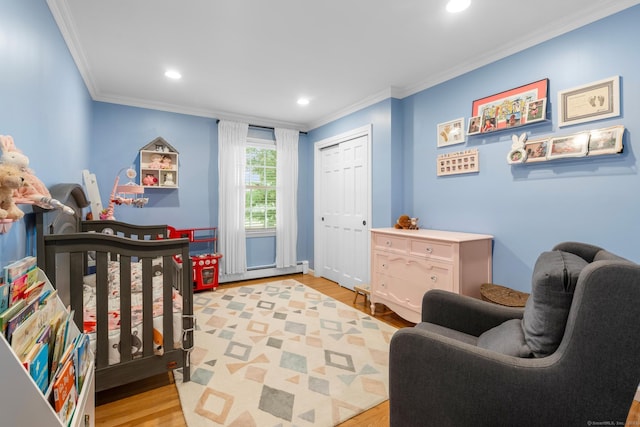 68 Mopus Bridge Rd, Ridgefield, CT 06877 - bedroom with crown molding, light wood-type flooring, recessed lighting, a closet, and baseboard heating