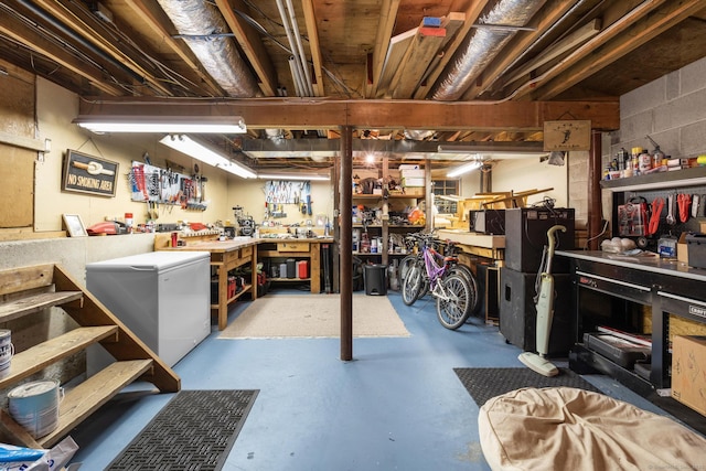 68 Mopus Bridge Rd, Ridgefield, CT 06877 - unfinished basement featuring a workshop area