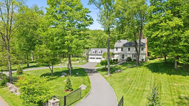 68 Mopus Bridge Rd, Ridgefield, CT 06877 - surrounding community with asphalt driveway and a garage