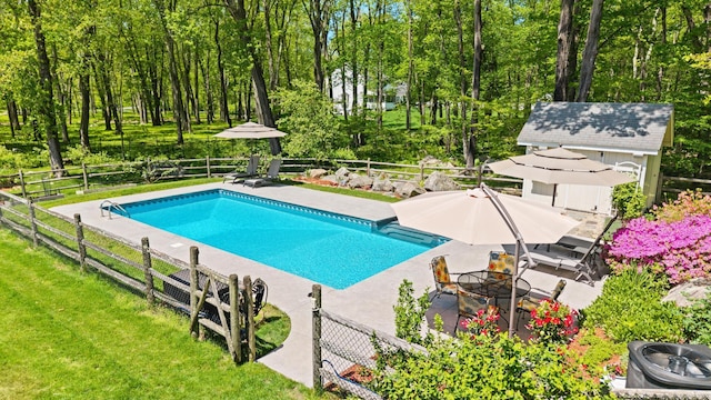 68 Mopus Bridge Rd, Ridgefield, CT 06877 - view of pool with a fire pit, a fenced backyard, a patio, and an outdoor structure