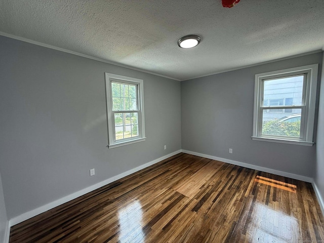 21 Lafayette Ave, East Hartford, CT 06118 - empty room with dark wood-style flooring, baseboards, a textured ceiling, and ornamental molding