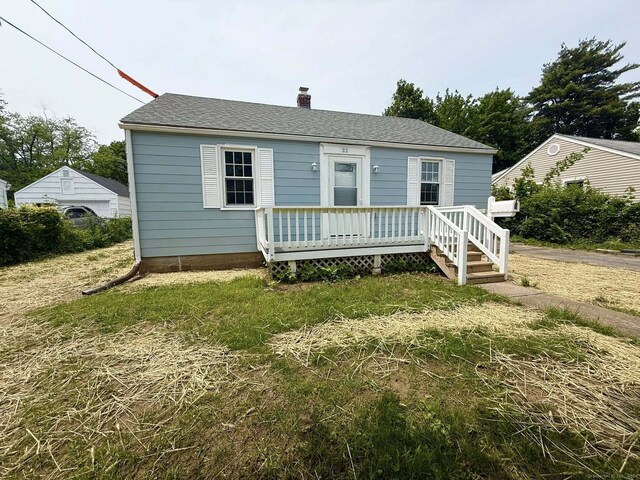 21 Lafayette Ave, East Hartford, CT 06118 - view of front of property with a chimney, a wooden deck, and a shingled roof