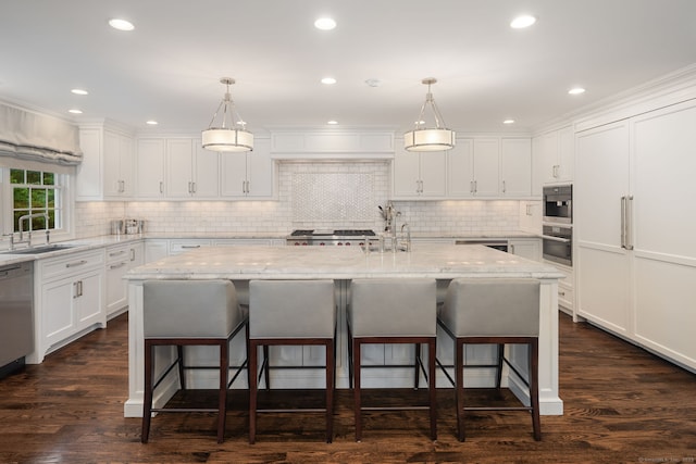 133 Buttery Rd, New Canaan, CT 06840 - kitchen with a kitchen breakfast bar, white cabinetry, decorative backsplash, an island with sink, and recessed lighting