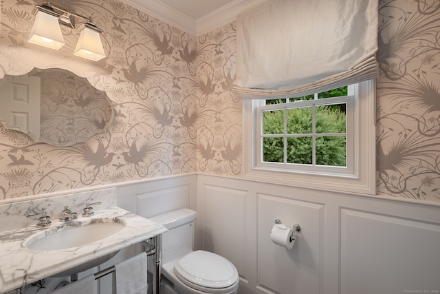 133 Buttery Rd, New Canaan, CT 06840 - half bathroom featuring wallpapered walls, crown molding, wainscoting, vanity, and a decorative wall