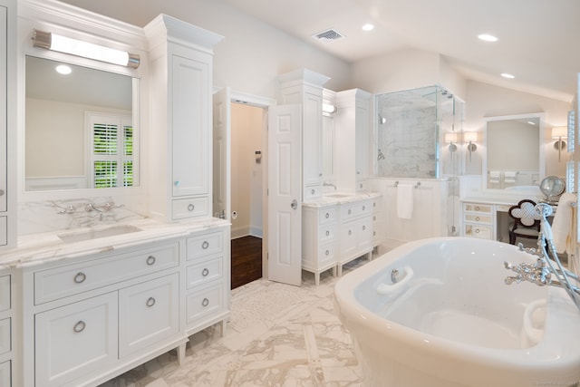 133 Buttery Rd, New Canaan, CT 06840 - bathroom featuring a freestanding tub, two vanities, recessed lighting, lofted ceiling, and a stall shower