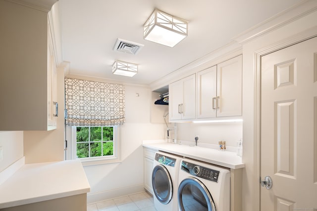 133 Buttery Rd, New Canaan, CT 06840 - washroom with independent washer and dryer, cabinet space, light tile patterned floors, and ornamental molding