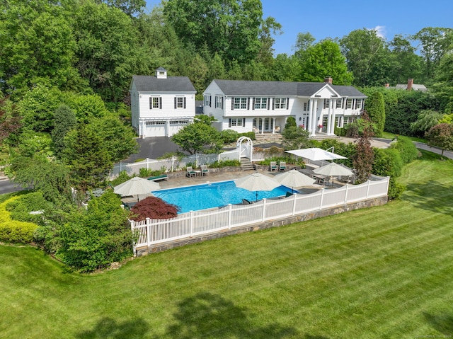 133 Buttery Rd, New Canaan, CT 06840 - rear view of property with a fenced backyard and a chimney