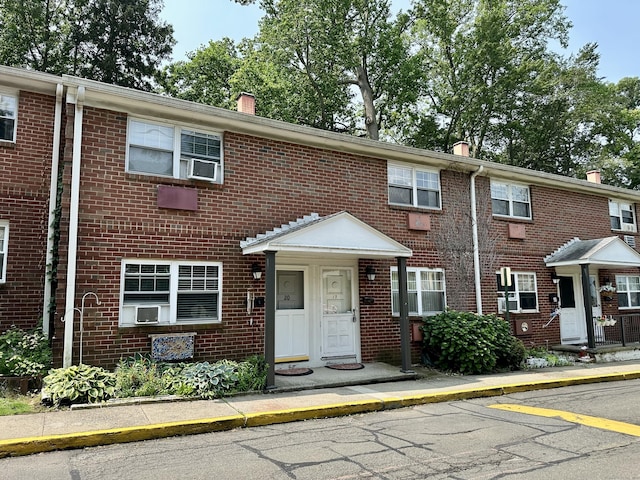 24 Woodward Ave Apt 19, New Haven, CT 06512 - townhome / multi-family property featuring brick siding, a chimney, and cooling unit