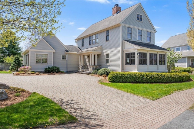 1 Osprey Commons S, Clinton, CT 06413 - view of front of home featuring a chimney and driveway
