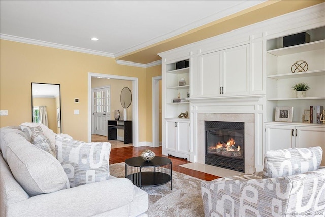 1 Osprey Commons S, Clinton, CT 06413 - living area with crown molding, wood finished floors, a fireplace, recessed lighting, and baseboards