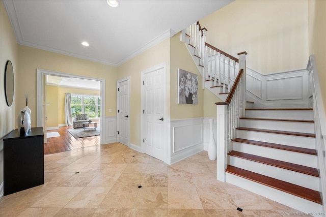 1 Osprey Commons S, Clinton, CT 06413 - foyer entrance featuring a decorative wall, crown molding, stairway, a wainscoted wall, and recessed lighting