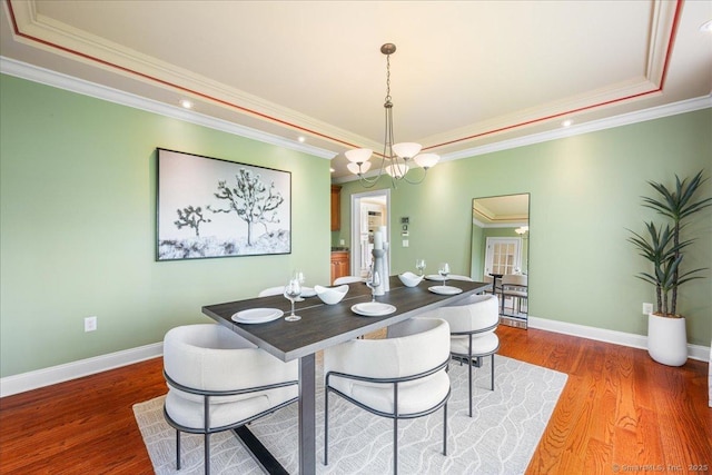 1 Osprey Commons S, Clinton, CT 06413 - dining room featuring a raised ceiling, wood finished floors, ornamental molding, recessed lighting, and baseboards