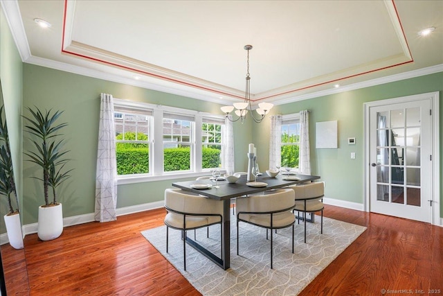 1 Osprey Commons S, Clinton, CT 06413 - dining room with a tray ceiling, a chandelier, wood finished floors, ornamental molding, and recessed lighting
