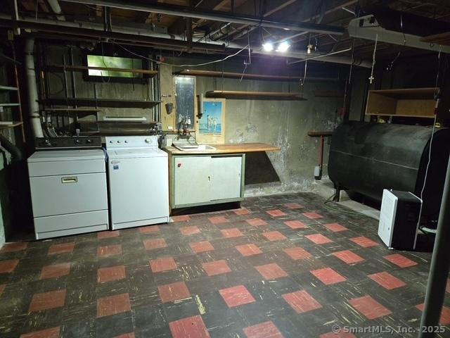 20 Kimball Rd, Wethersfield, CT 06109 - unfinished basement with washer and clothes dryer, heating fuel, and tile patterned floors