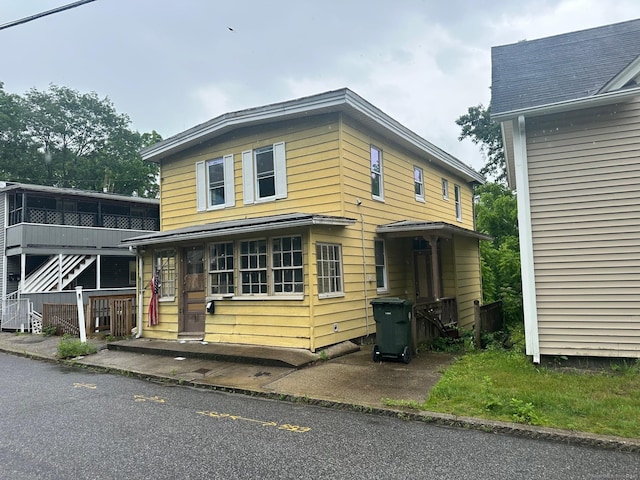 57 Chapman St, Windham, CT 06226 - view of front of home featuring stairway