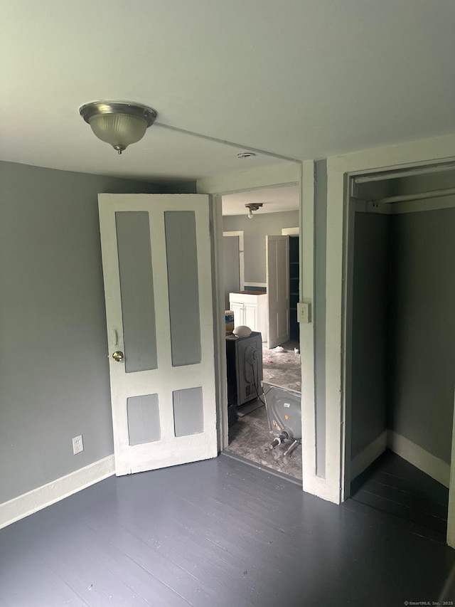 57 Chapman St, Windham, CT 06226 - hall with baseboards and dark wood finished floors