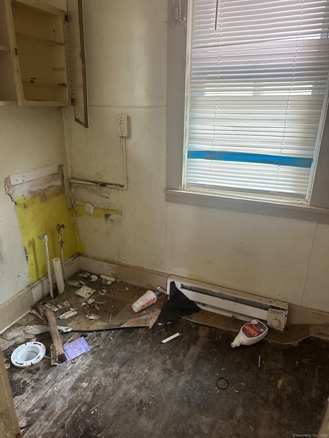 57 Chapman St, Windham, CT 06226 - empty room featuring a baseboard heating unit