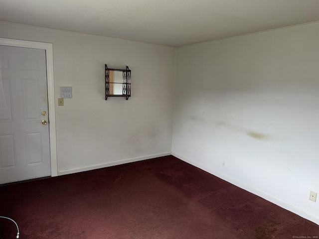 52 Robin Rd Apt B1, West Hartford, CT 06119 - spare room with dark colored carpet and baseboards