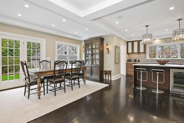 11 Old Hill Rd, Westport, CT 06880 - dining room with beverage cooler, dark wood-type flooring, recessed lighting, and a chandelier