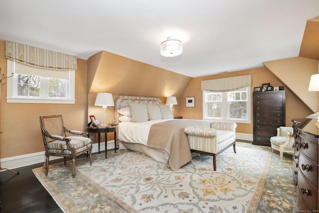 11 Old Hill Rd, Westport, CT 06880 - bedroom featuring multiple windows, wood finished floors, and vaulted ceiling