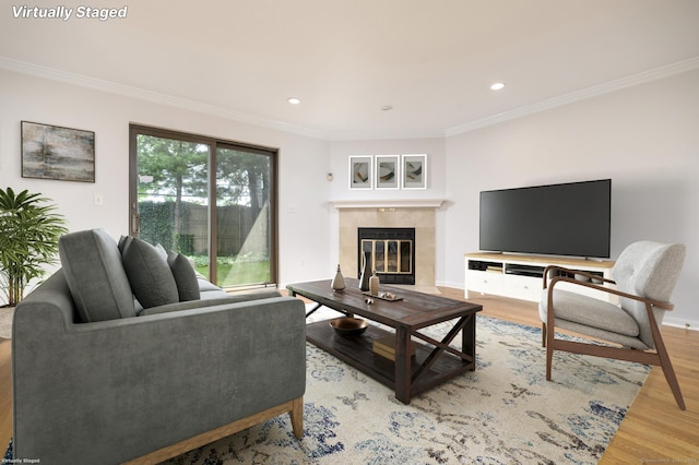 668 Glenbrook Rd Unit 9, Stamford, CT 06906 - living room featuring crown molding, light wood-type flooring, a tile fireplace, and recessed lighting
