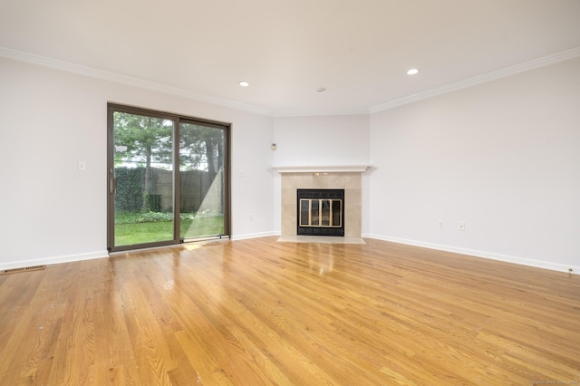668 Glenbrook Rd Unit 9, Stamford, CT 06906 - unfurnished living room with a tiled fireplace, ornamental molding, light wood-style flooring, recessed lighting, and baseboards