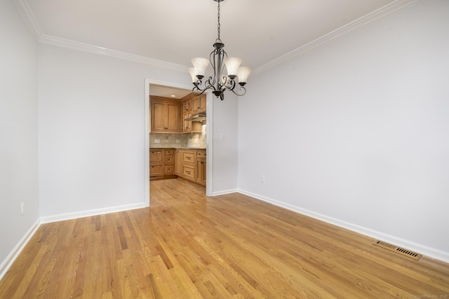 668 Glenbrook Rd Unit 9, Stamford, CT 06906 - unfurnished dining area with a chandelier, crown molding, baseboards, and light wood-type flooring