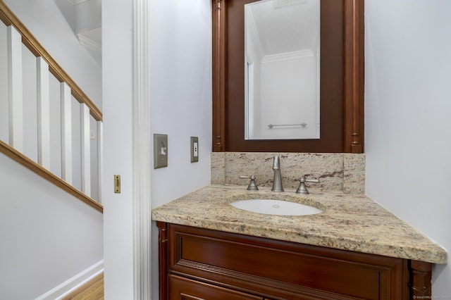 668 Glenbrook Rd Unit 9, Stamford, CT 06906 - bathroom with crown molding, vanity, and tasteful backsplash