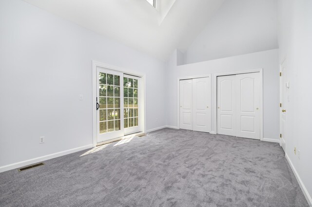 668 Glenbrook Rd Unit 9, Stamford, CT 06906 - unfurnished bedroom with high vaulted ceiling, multiple closets, carpet floors, and baseboards