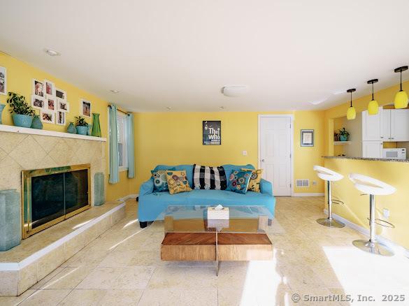 847 Glenbrook Rd, Orange, CT 06477 - living area featuring a premium fireplace and baseboards