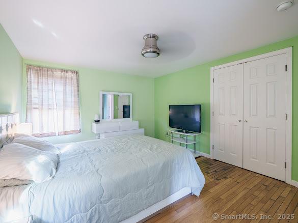 847 Glenbrook Rd, Orange, CT 06477 - bedroom with wood finished floors, a closet, and ceiling fan