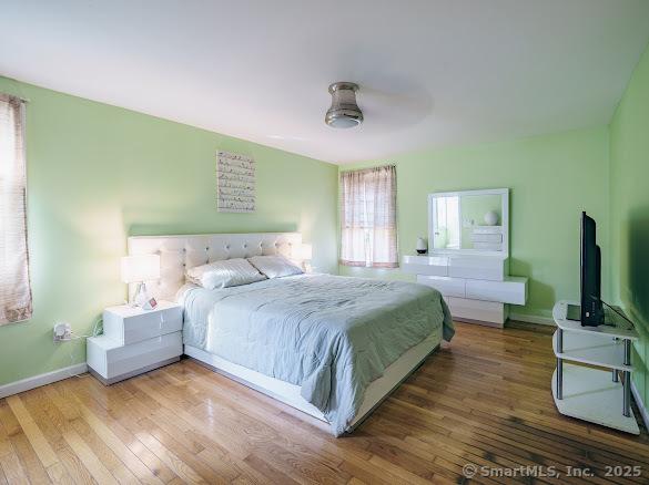 847 Glenbrook Rd, Orange, CT 06477 - bedroom featuring hardwood / wood-style flooring and ceiling fan