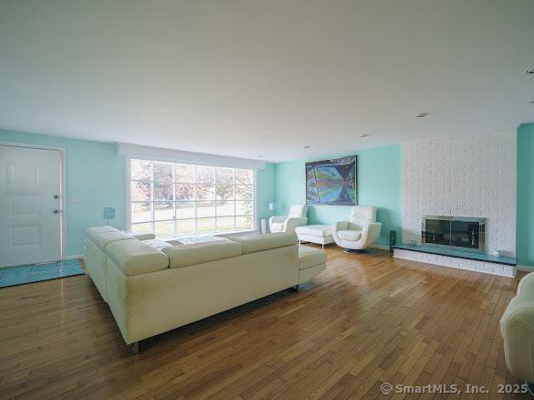 847 Glenbrook Rd, Orange, CT 06477 - living area featuring wood finished floors and a fireplace