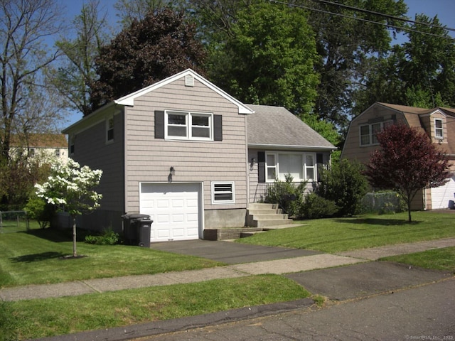 54 Bates St, Hartford, CT 06114 - tri-level home featuring an attached garage, a front lawn, and driveway