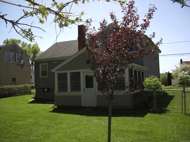 54 Bates St, Hartford, CT 06114 - rear view of property featuring a chimney and roof with shingles