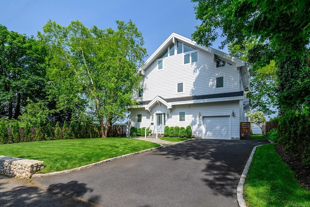 13 Seabreeze Pl, Norwalk, CT 06854 - view of front of property with a garage and asphalt driveway