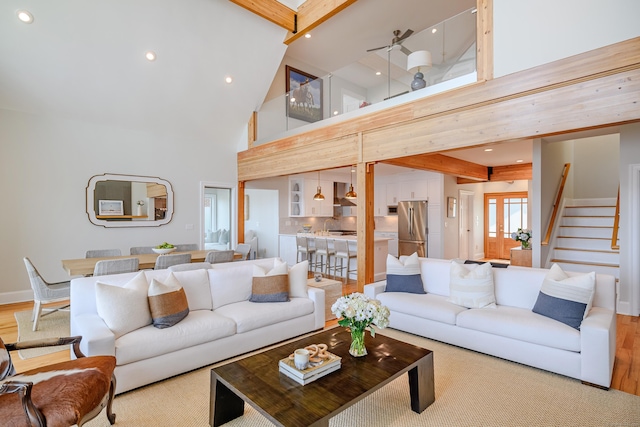 13 Seabreeze Pl, Norwalk, CT 06854 - living area with high vaulted ceiling, beamed ceiling, wood finished floors, stairway, and recessed lighting