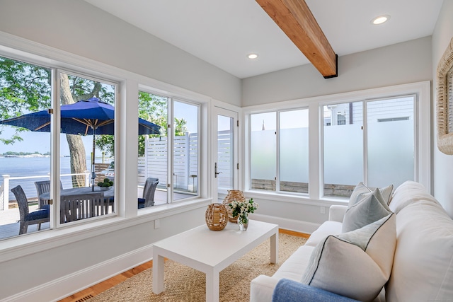 13 Seabreeze Pl, Norwalk, CT 06854 - sunroom featuring wood finished floors, healthy amount of natural light, beam ceiling, a water view, and baseboards