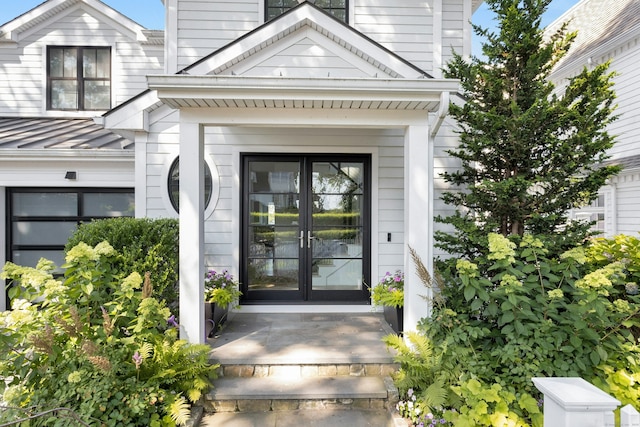47 Pine Point Rd, Norwalk, CT 06853 - view of exterior entry with french doors, a standing seam roof, and a metal roof
