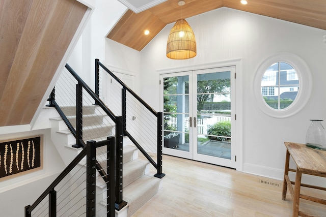 47 Pine Point Rd, Norwalk, CT 06853 - foyer entrance with vaulted ceiling, wood finished floors, stairs, and recessed lighting